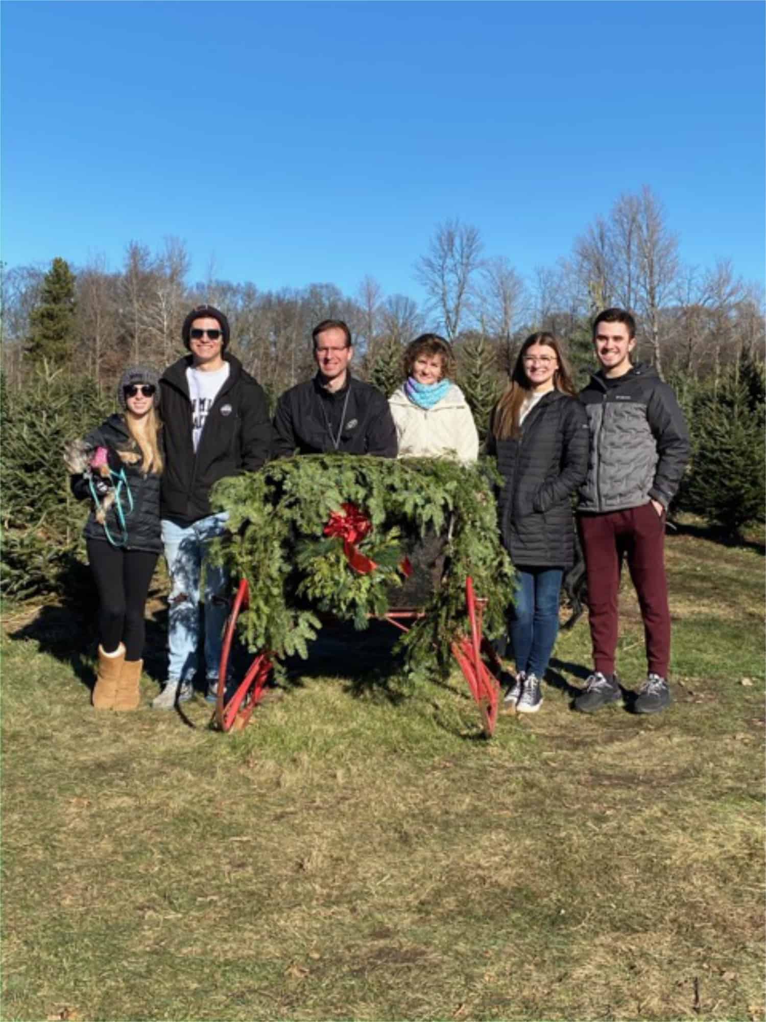 Family in Christmas sleigh.