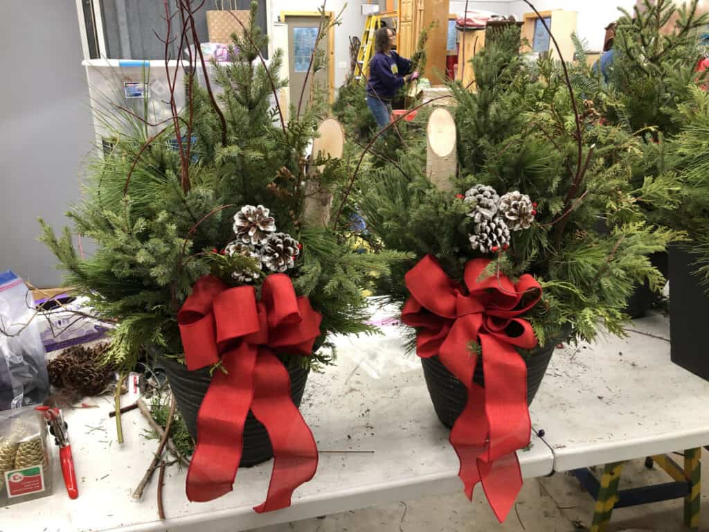 Decorated Christmas porch pots.